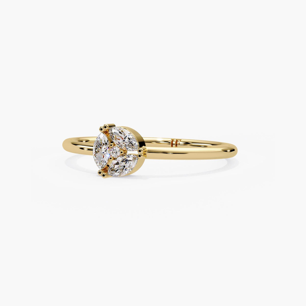 14k yellow gold marquise cluster ring, three prong set marquise diamonds circling a round center on a dainty band.