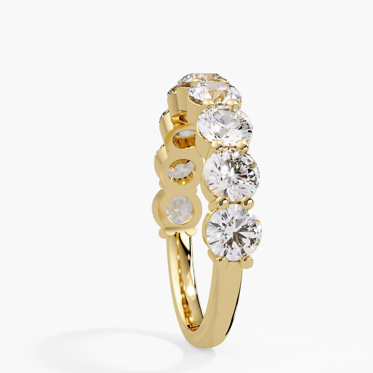Low setting round diamond half eternity ring in 14K yellow gold, showing shared prongs, open diamond baskets, and a polished shank.