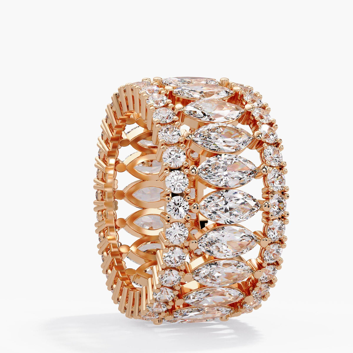 14K rose gold and diamond anniversary ring with three rows of lab grown diamonds, tilted to show the full eternity design, marquise settings and open gold interior.