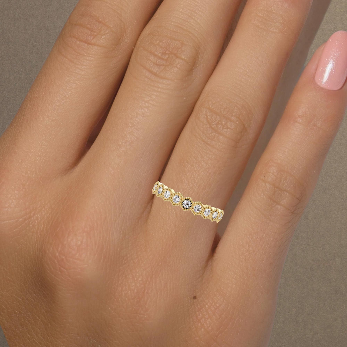 Dainty natural diamond stacking band in yellow gold, featuring a repeating hexagonal pattern with vintage-inspired milgrain detailing.