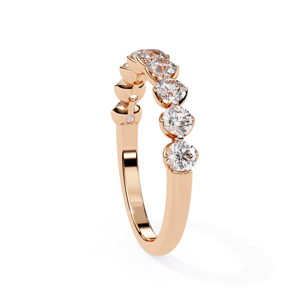 a gold ring with nine diamonds on it