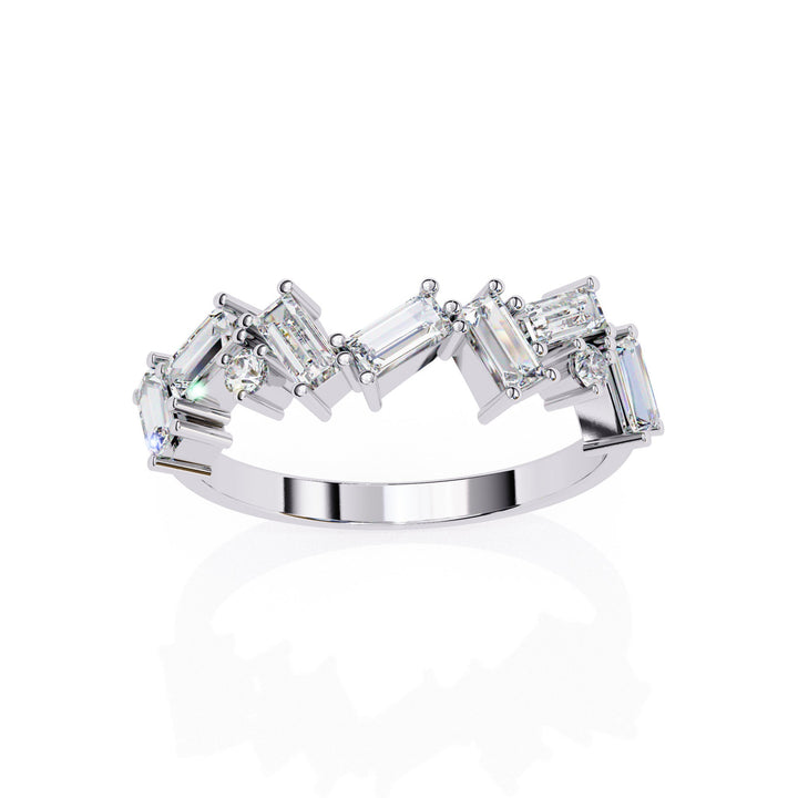 A white gold ring with baguette and round shaped diamonds.