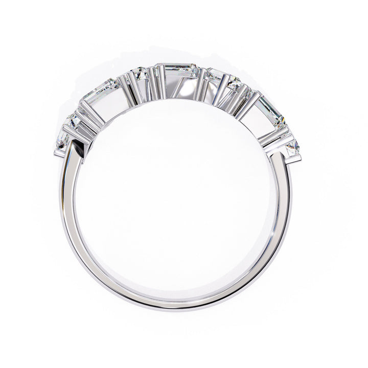 A white gold ring with baguette and round shaped diamonds.