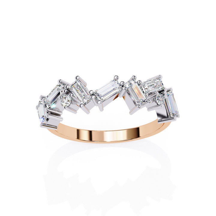 A rose gold ring with baguette and round shaped diamonds.