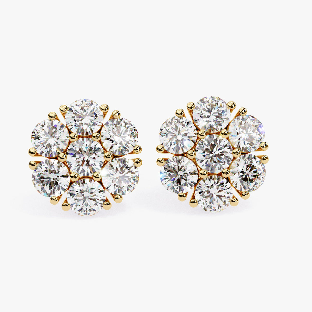 A pair of 14k yellow gold flower-shaped earrings with round lab-grown diamonds. Each earring features seven diamonds arranged in a circular floral cluster setting.