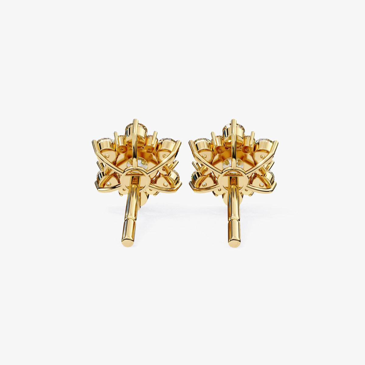 Back view of a pair of yellow gold floral diamond earrings showing the prong-set structure and basket-style setting with posts extending outward.