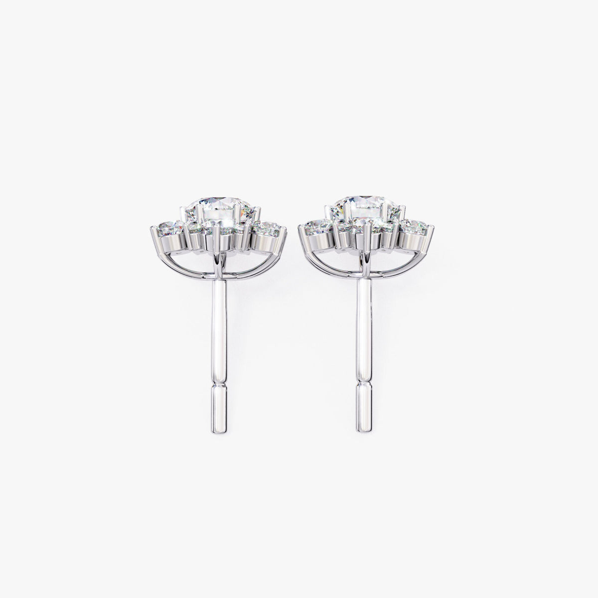Profile view of the earring showing the raised floral setting and 14k gold post and backing.