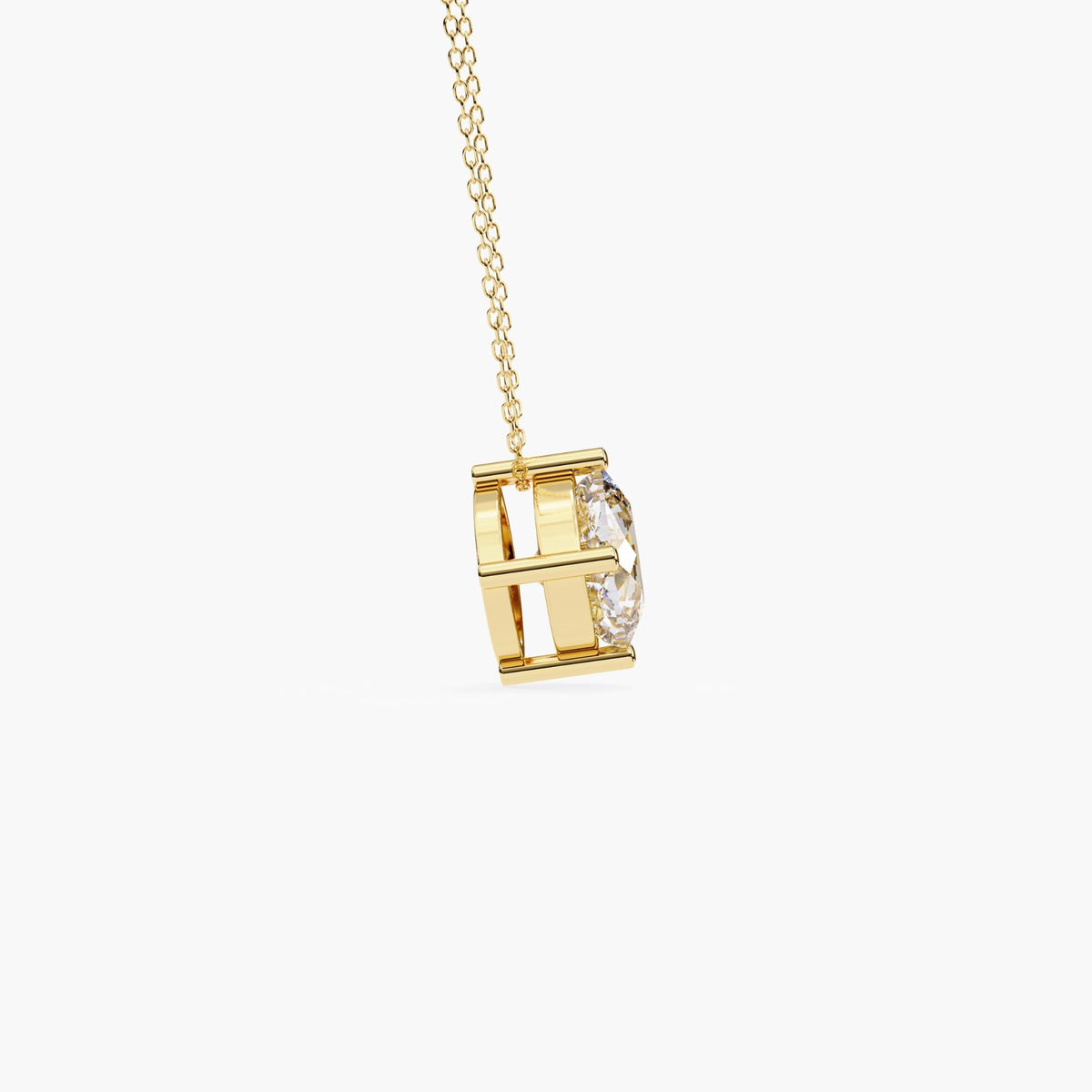 Side profile view of a cushion cut lab-grown diamond pendant in a 14k yellow gold prong setting, showing the open gallery and secure chain attachment.