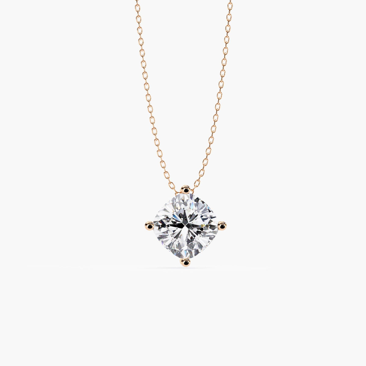 Front view of a cushion cut lab-grown diamond necklace in 14k rose gold, featuring a solitaire diamond set in four prongs on a delicate cable chain.