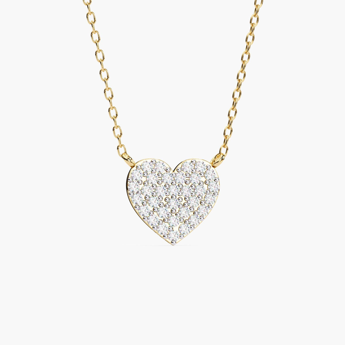 A close-up front view of a 14k yellow gold pavé heart necklace with 32 round lab-grown diamonds. The heart pendant is suspended from a delicate cable chain and features a tightly set diamond surface for maximum sparkle.
