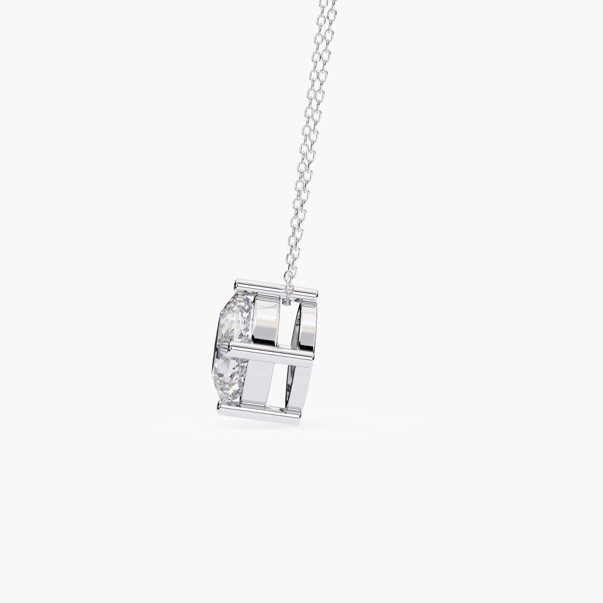 Side view of a cushion cut lab-grown diamond pendant in a 14k white gold setting, highlighting the structured open gallery and prong-mounted diamond.