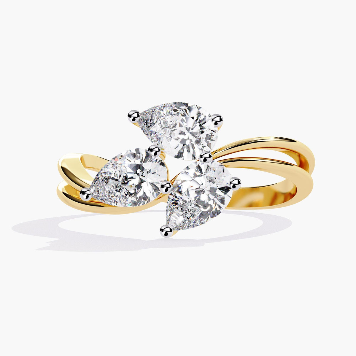 A gold ring with a delicate branch design featuring clear, marquise-shaped stones.