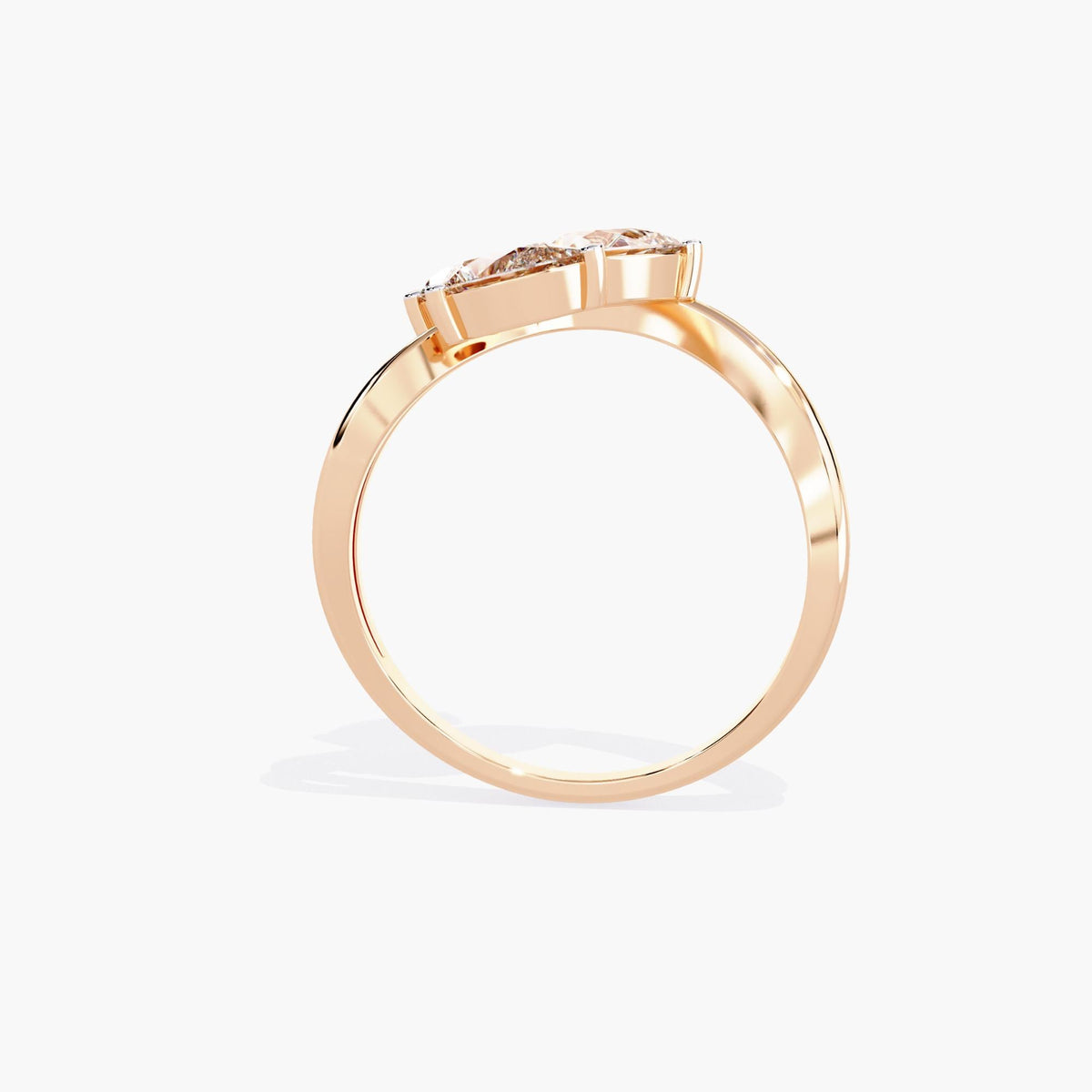 A gold ring with a delicate branch design featuring clear, marquise-shaped stones.