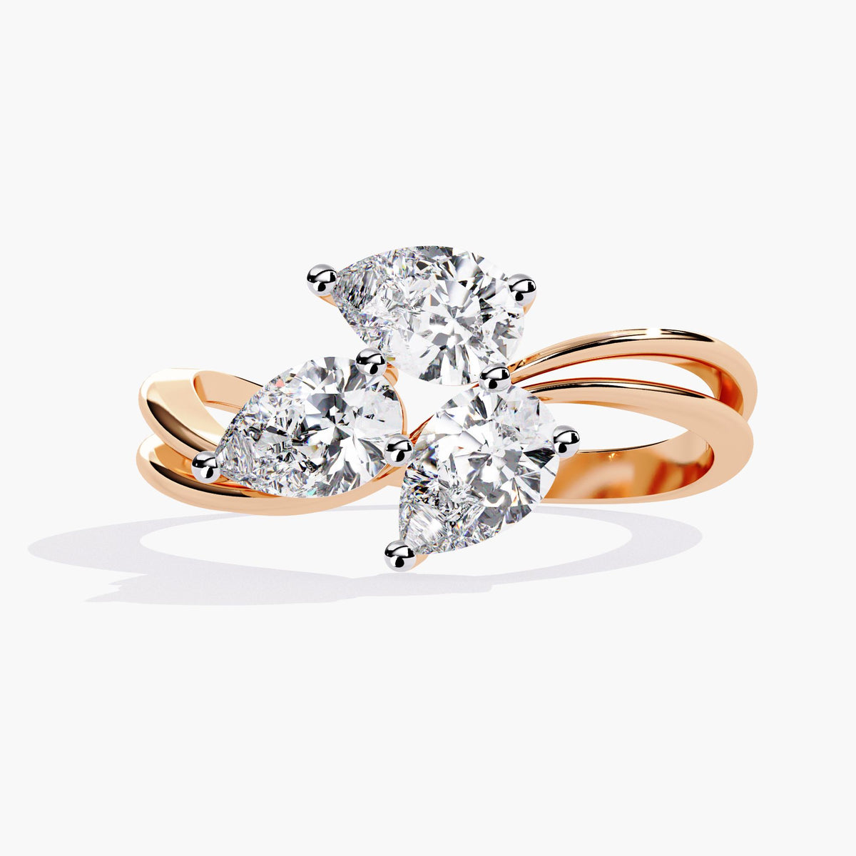 A gold ring with a delicate branch design featuring clear, marquise-shaped stones.