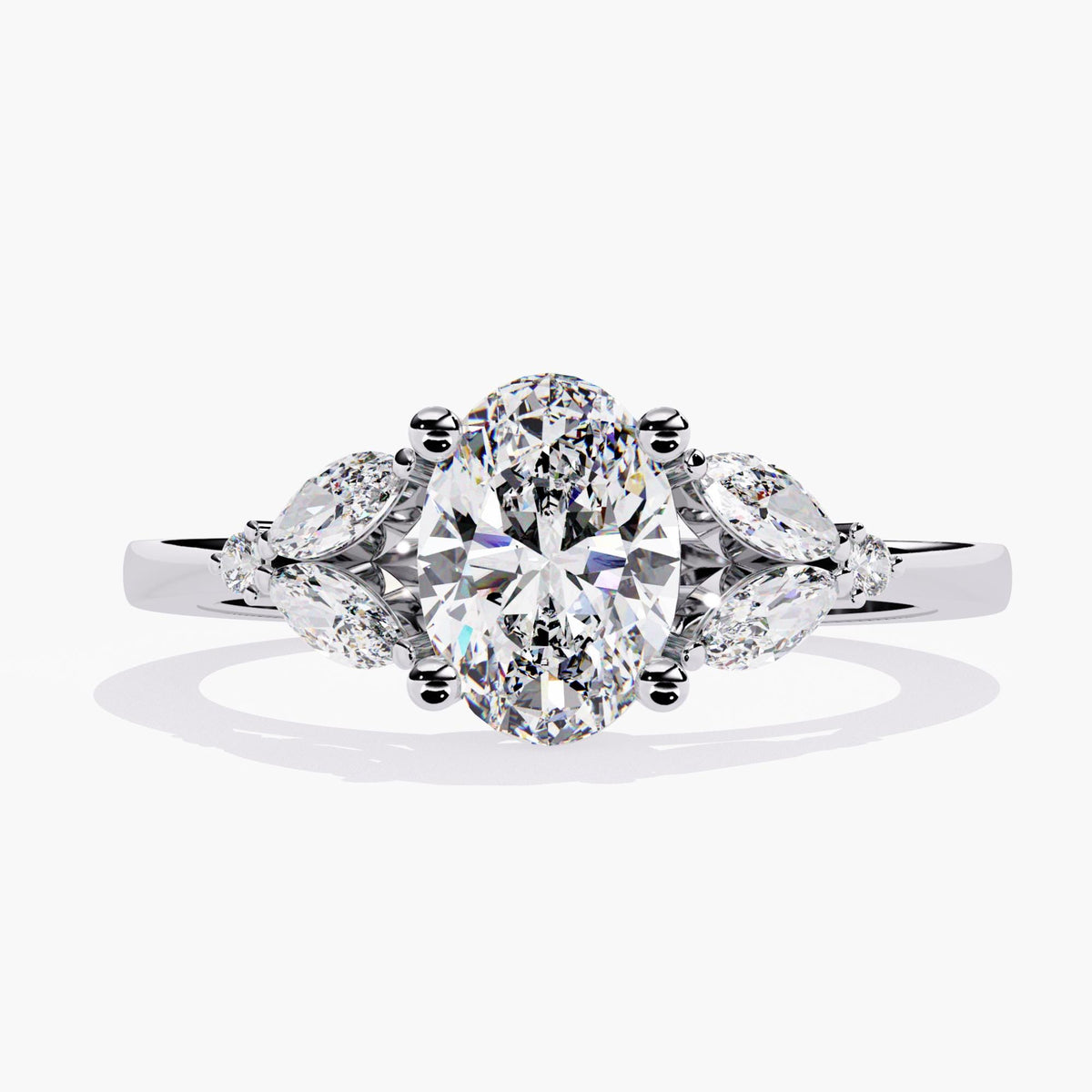 A white gold engagement ring with a large oval-shaped diamond and smaller diamonds.