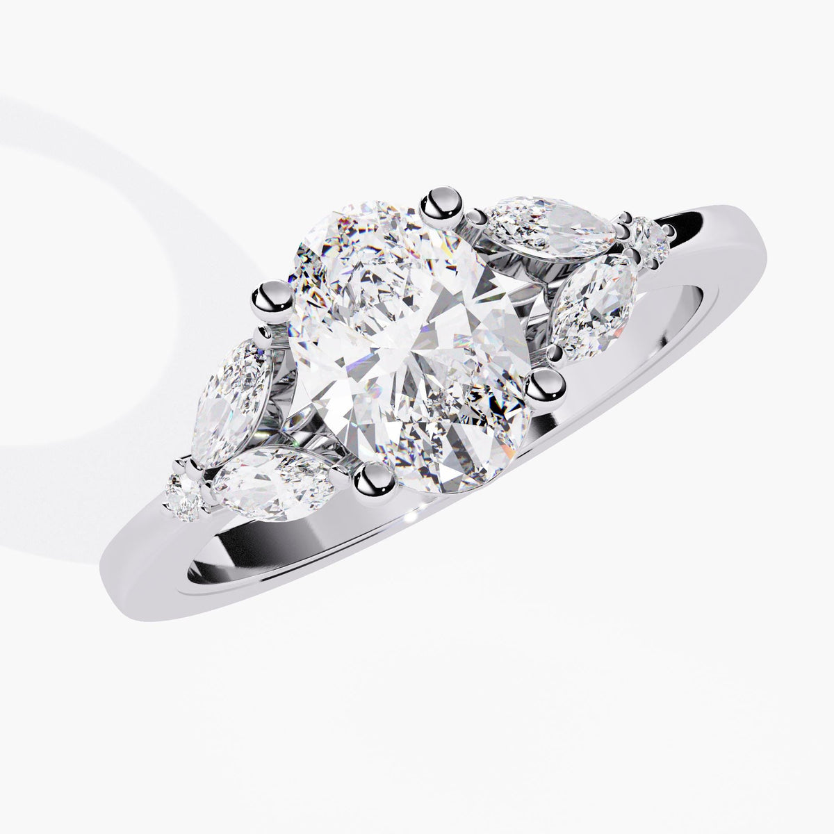 A white gold engagement ring with a large oval-shaped diamond and smaller diamonds.