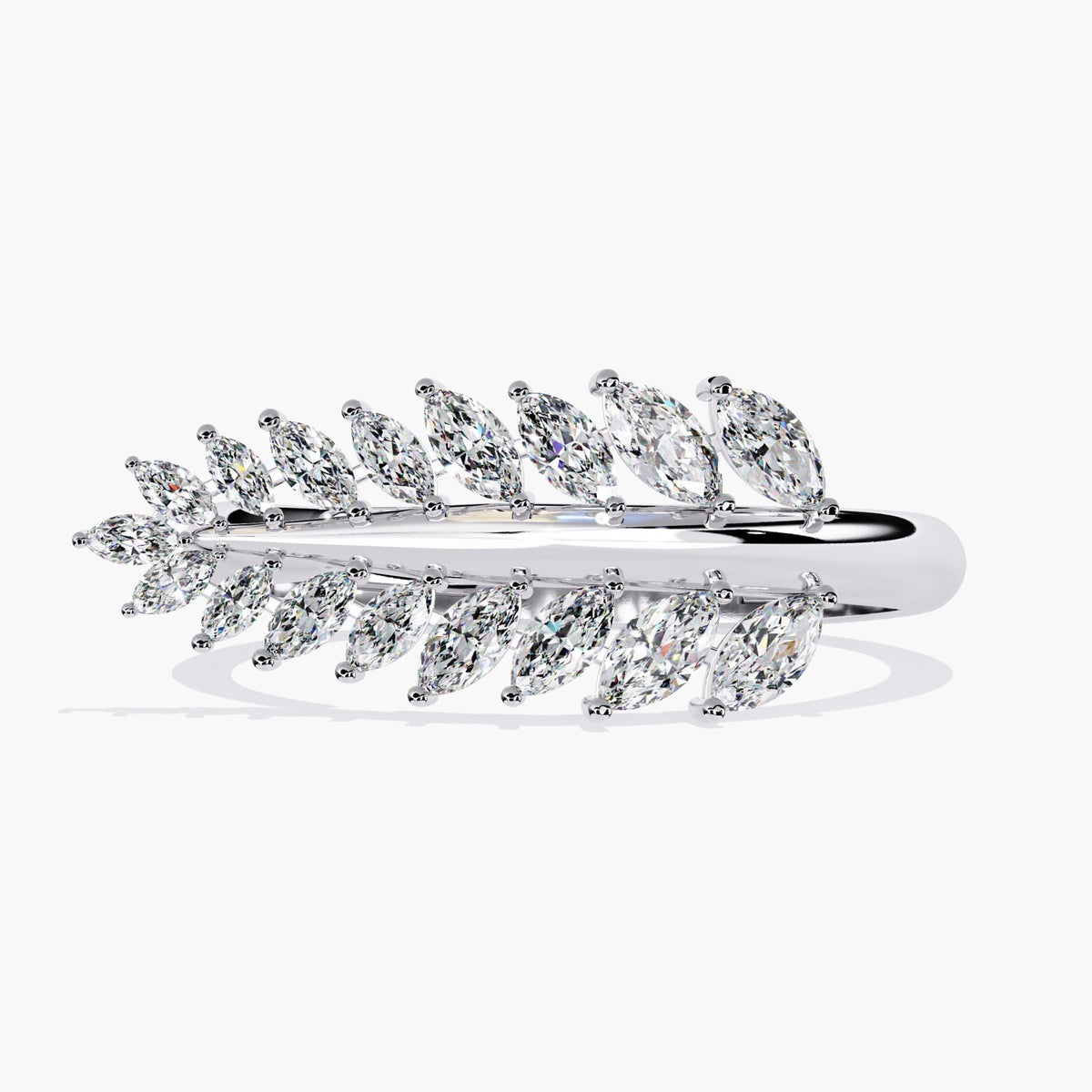 A white gold ring with a leaf design and small diamonds.