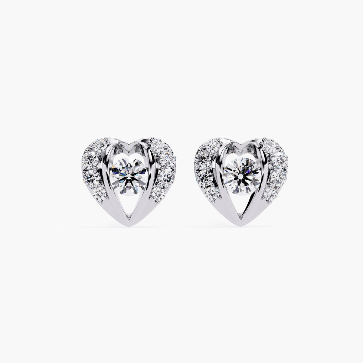 A pair of small heart-shaped earrings featuring a solitaire diamond at the center, surrounded by a pavé diamond setting.