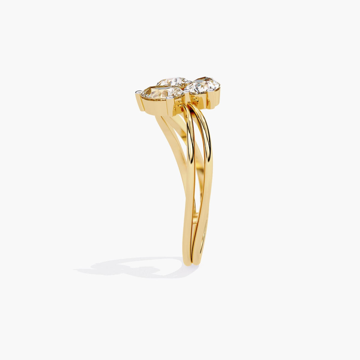 A gold ring with a delicate branch design featuring clear, marquise-shaped stones.