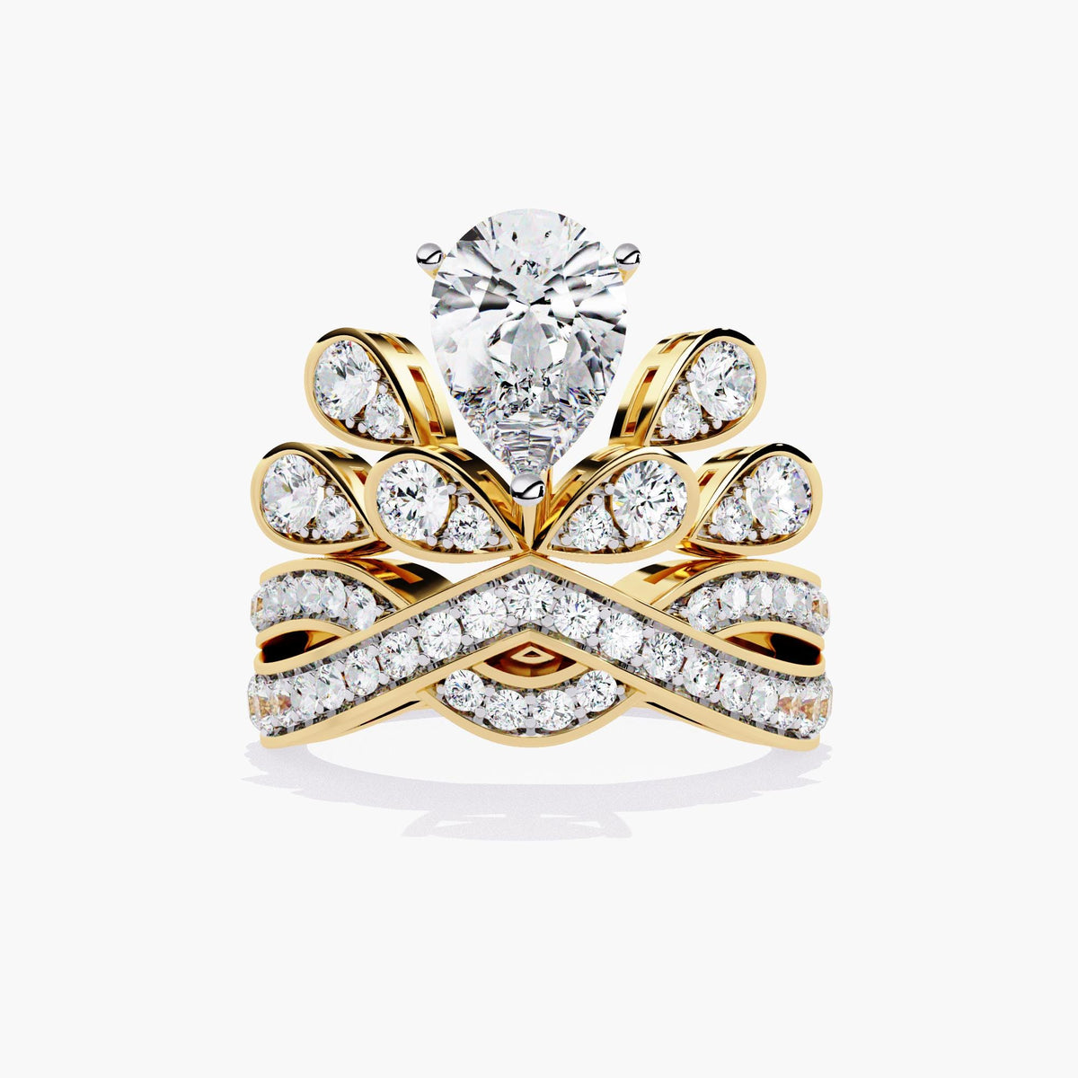 A gold ring with a pear-shaped diamond center stone and smaller diamonds set in a crown-like design.