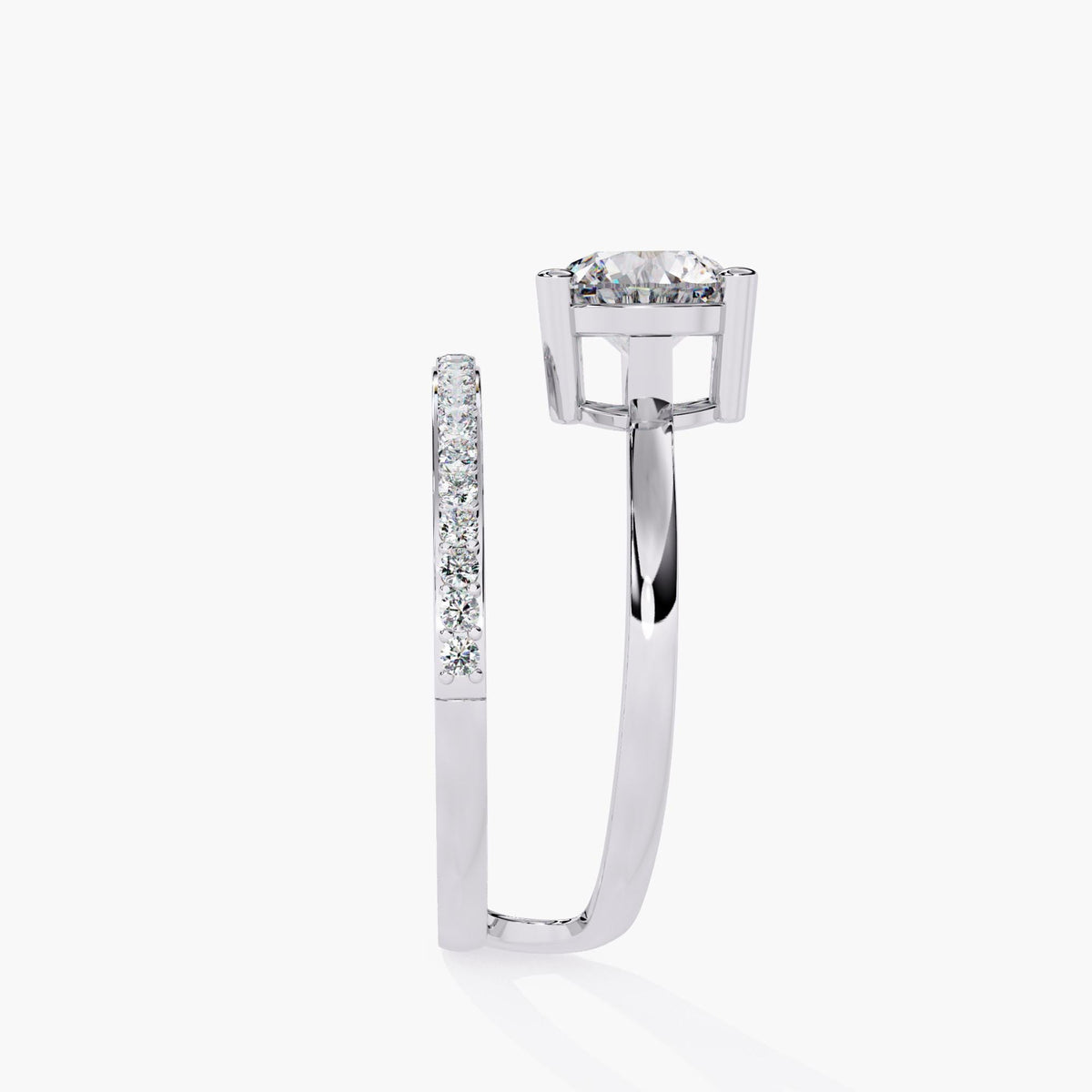 A white gold engagement ring with a round brilliant cut diamond center stone and a pave diamond band. The band is split and wraps around the center stone.