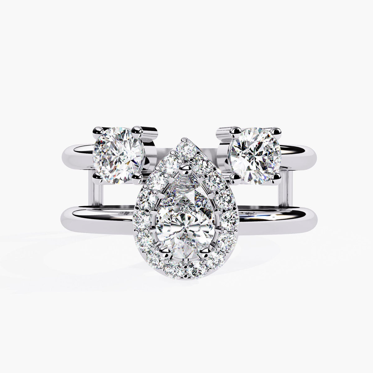 A three stone ring with a large center pear brilliant cut diamond and two smaller round brilliant cut diamonds on either side.