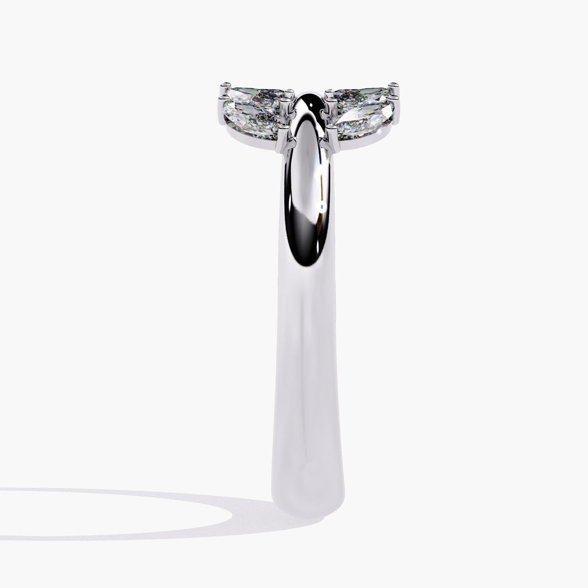 A white gold ring with a leaf design and small diamonds.