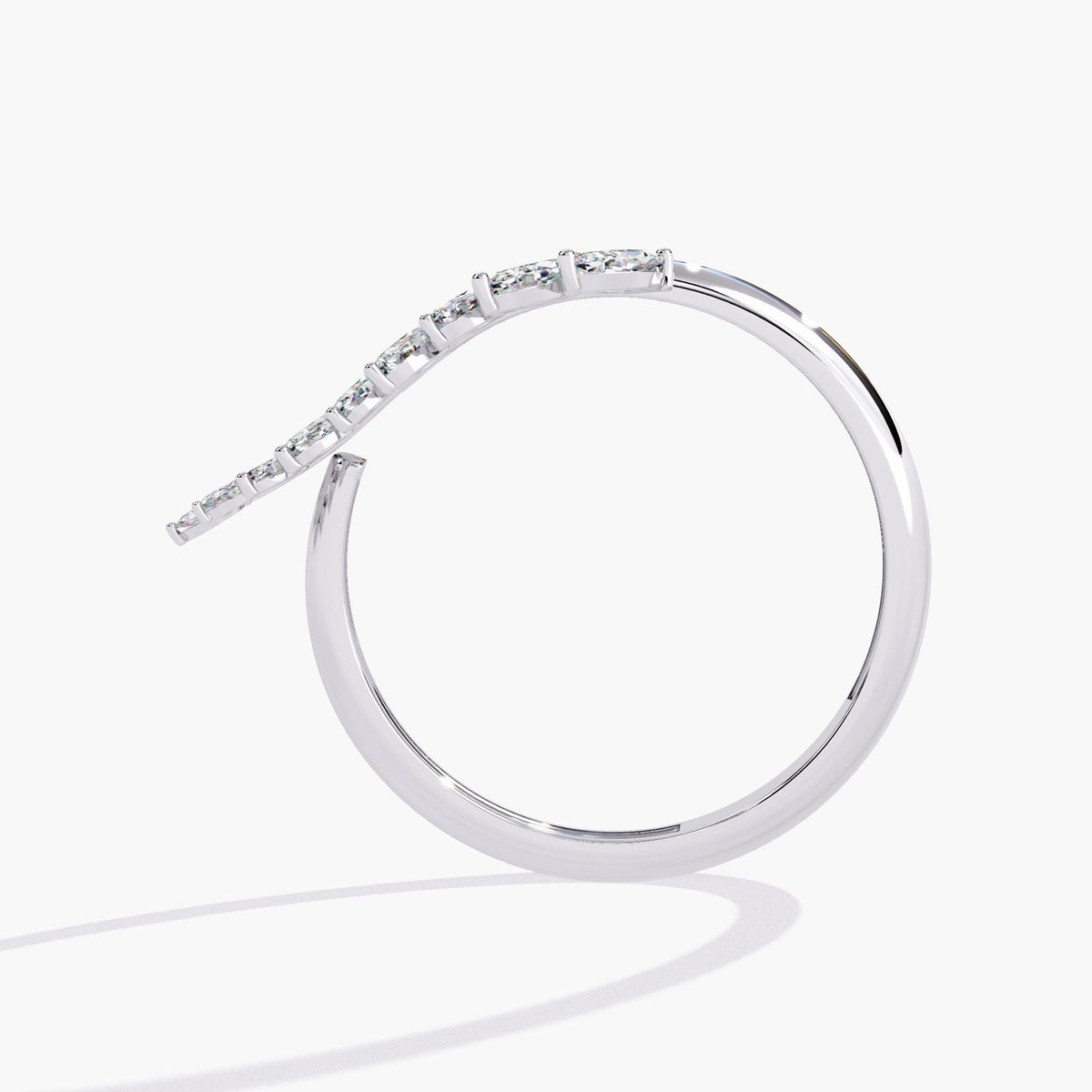 A white gold ring with a leaf design and small diamonds.