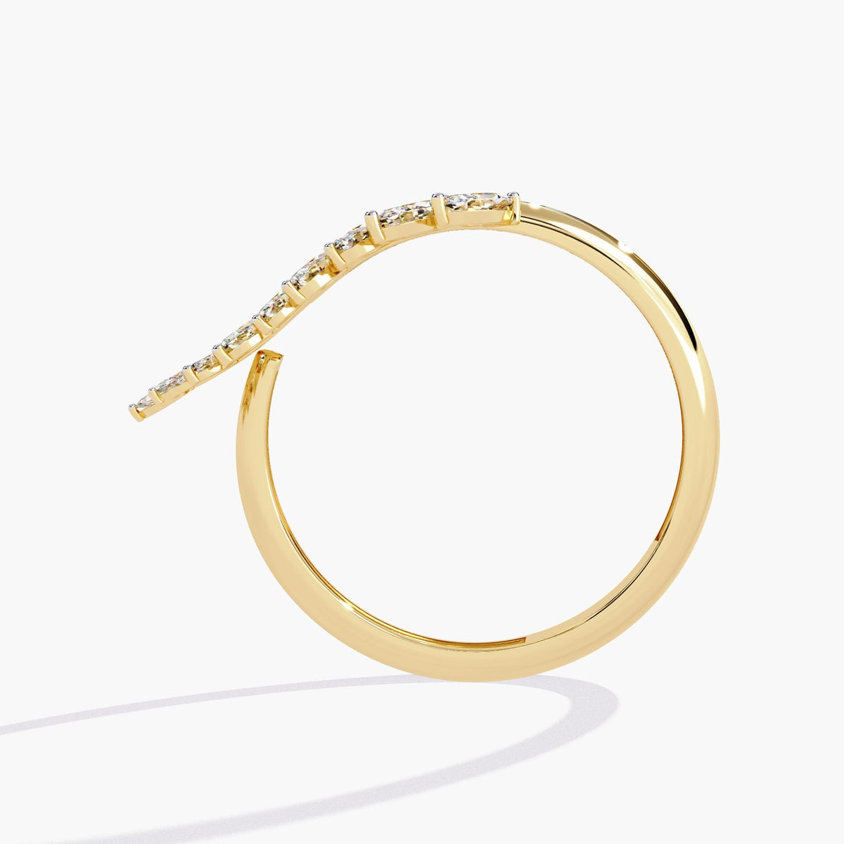 A gold ring with a leaf design and small diamonds.