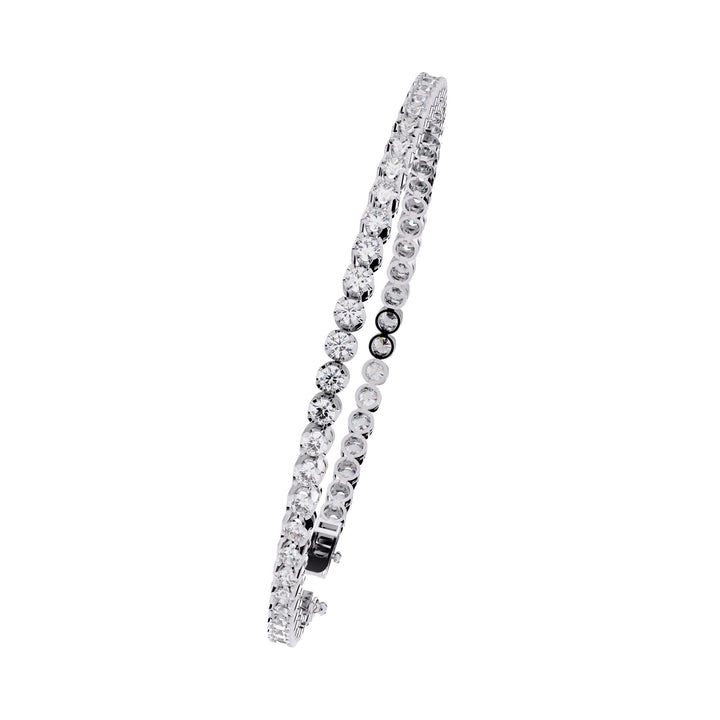 A white gold bracelet with a row of small clear diamonds.