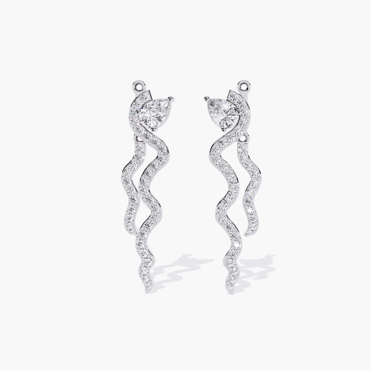 A pair of white gold diamond earrings with a spiral design. The earrings are dangling and have a thin, curved shape with small diamonds.