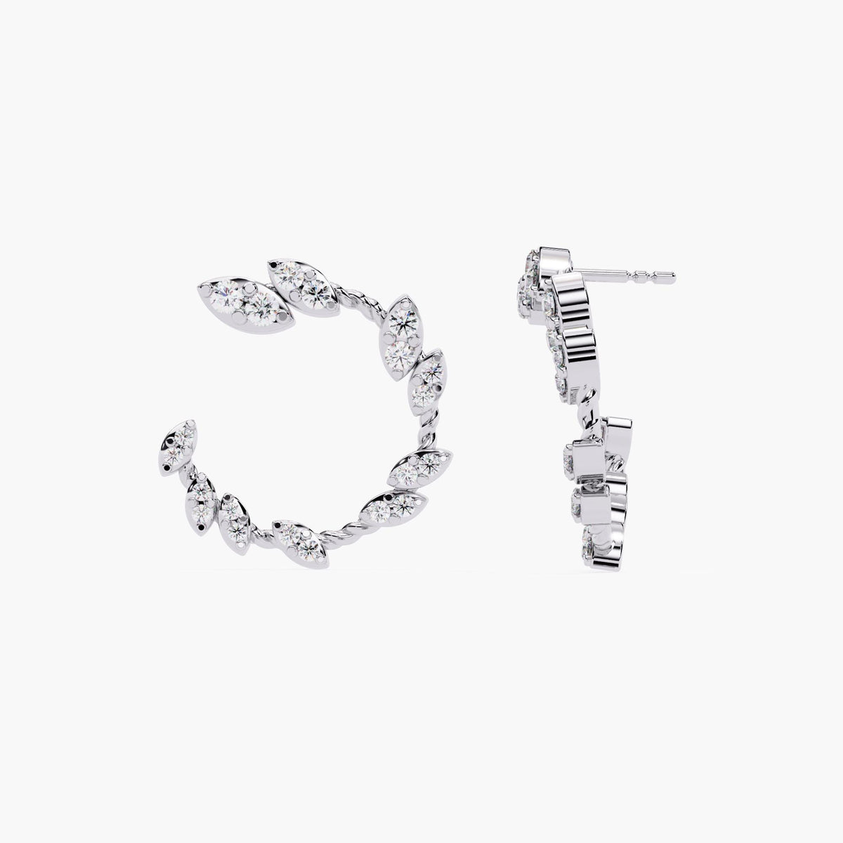 A pair of white gold earrings with marquise cut diamonds.