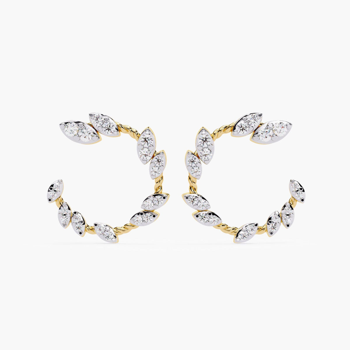 A pair of gold earrings with marquise cut diamonds.