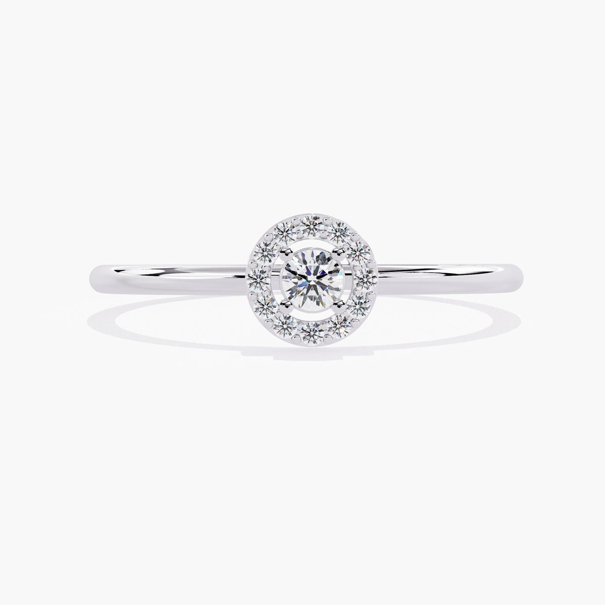 A white gold band ring with a single round diamond set in a halo of smaller diamonds.