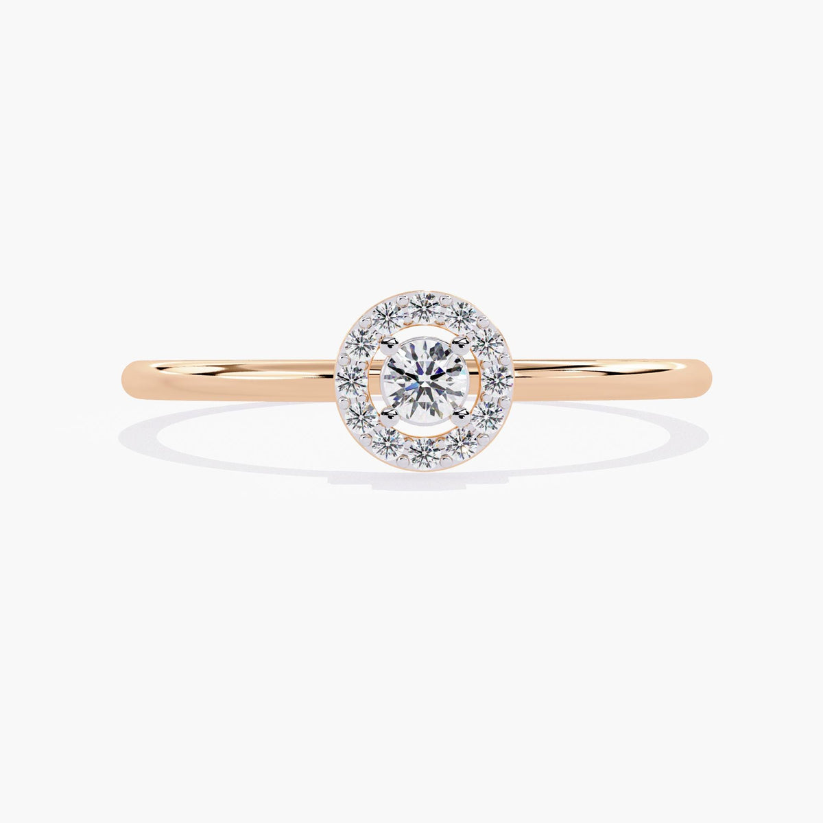 A rose gold band ring with a single round diamond set in a halo of smaller diamonds.