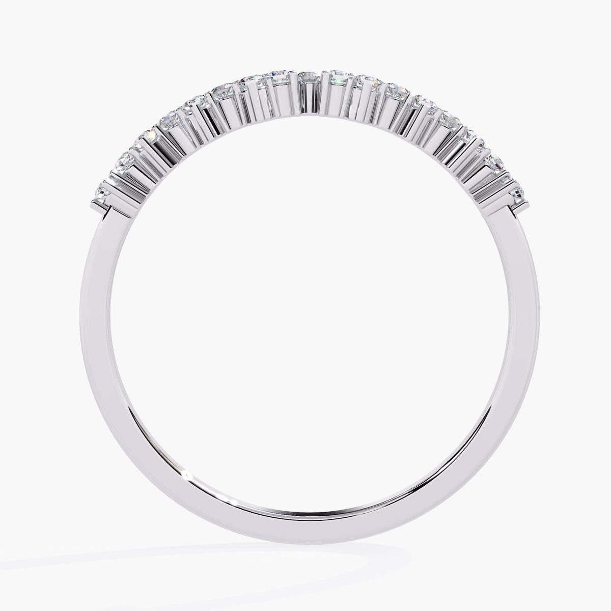 A white gold ring with a row of round diamonds set in a delicate band.