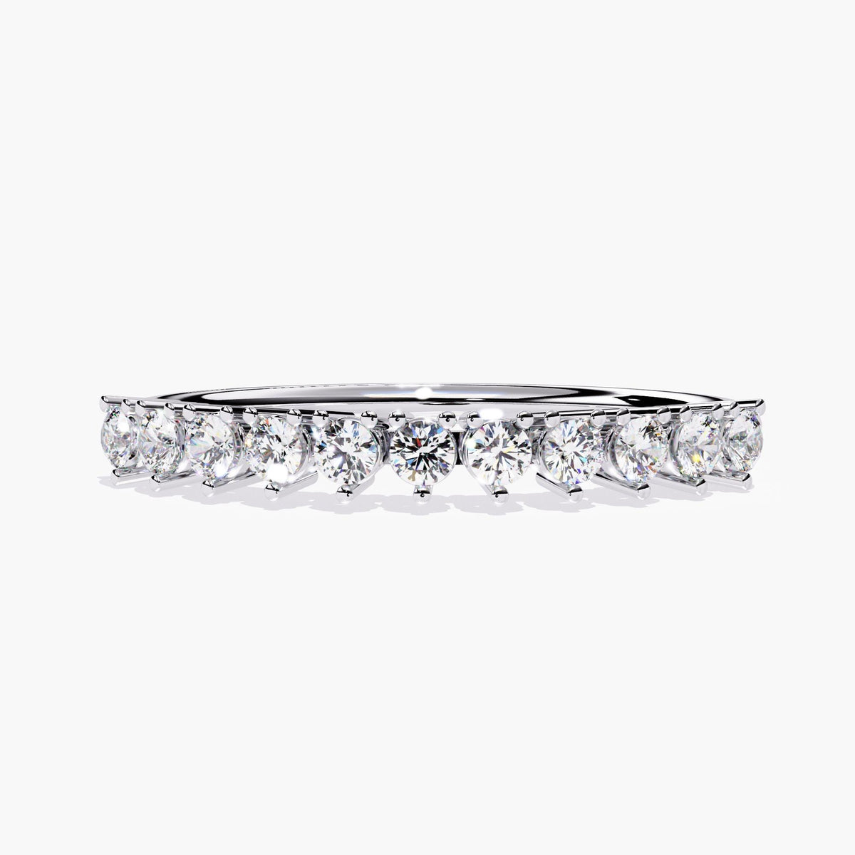 Front view of a 14K white gold half eternity ring featuring 11 round natural diamonds in a prong setting. The diamonds are evenly spaced across the top half of the slim band. Ideal as a wedding band or anniversary ring.