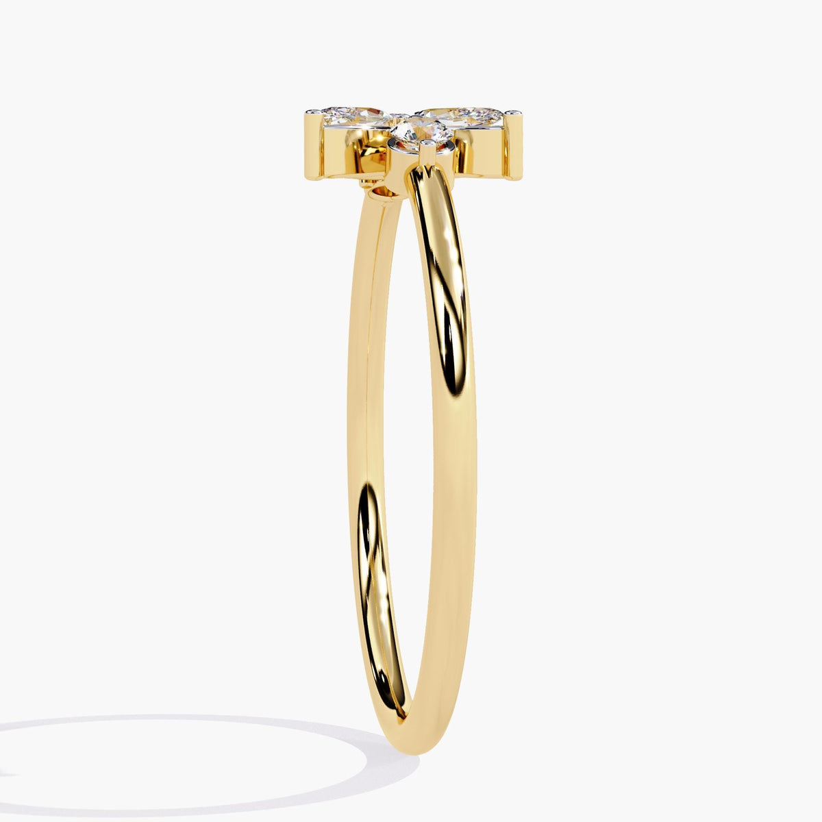 A yellow gold ring with a delicate leaf design featuring marquise-shaped diamonds and two round diamonds.