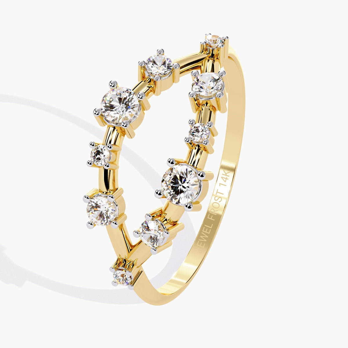 A yellow gold band with alternating round-cut diamonds set in a delicate open-band arrangement.