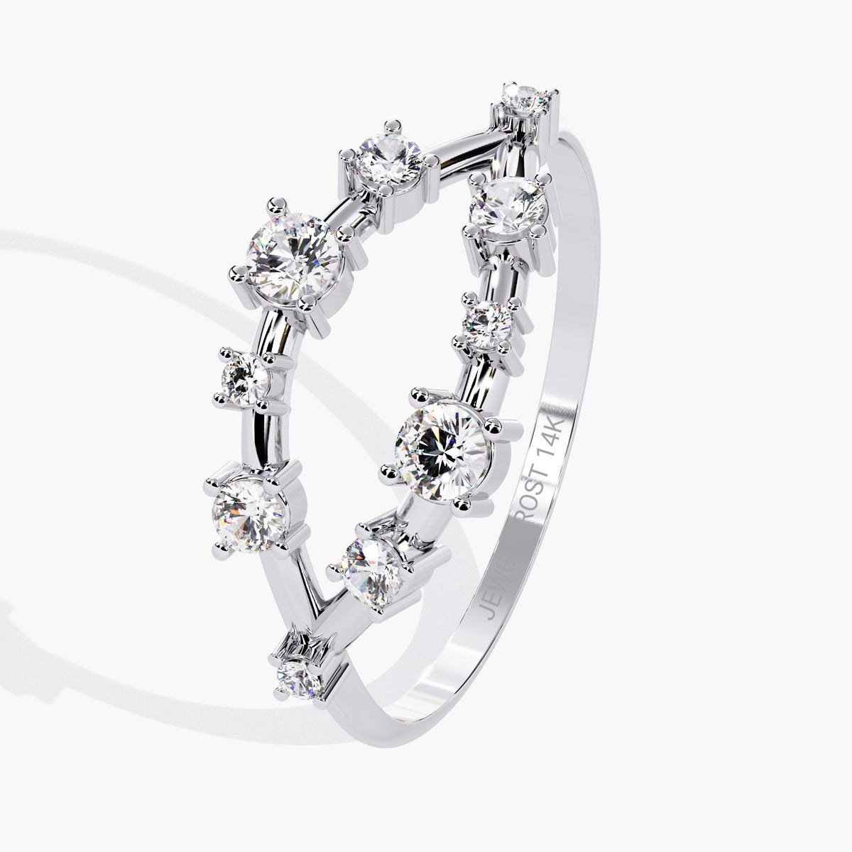 A white gold band with alternating round-cut diamonds set in a delicate open-band arrangement.