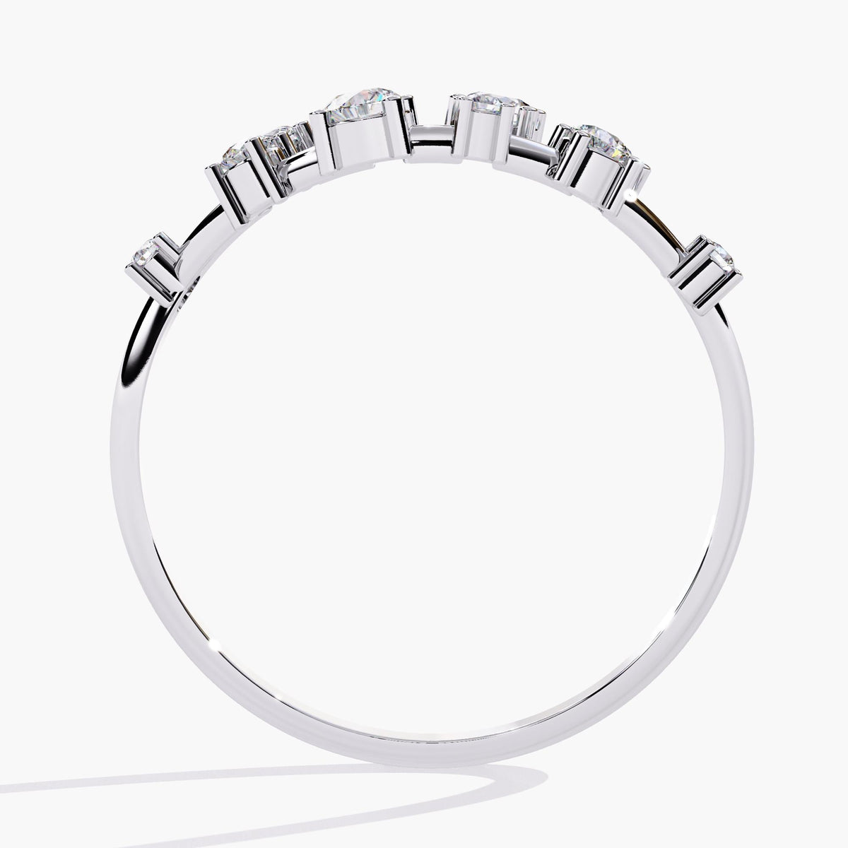 A white gold band with alternating round-cut diamonds set in a delicate open-band arrangement.