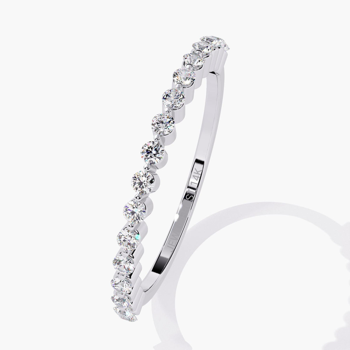 Angled view of a half eternity ring in 14k white gold, showcasing round lab-grown diamonds in a floating single prong setting with an ultra-thin band and inner 14K hallmark engraving