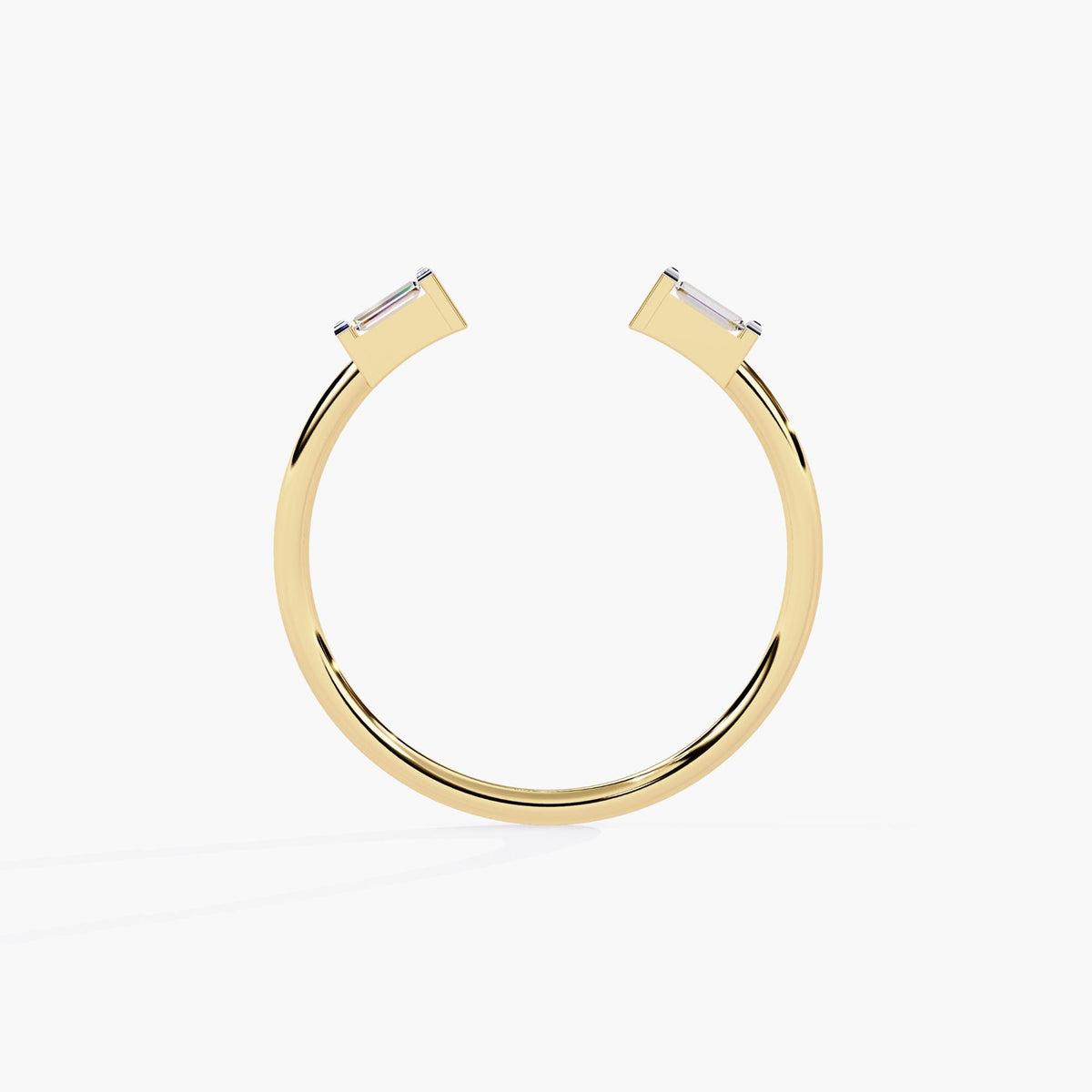 Top-down view of a 14K yellow gold open ring, showing two baguette-cut diamonds set horizontally in rectangular prong settings. The open silhouette adds a modern touch, making it a distinctive anniversary or bridesmaid gift.