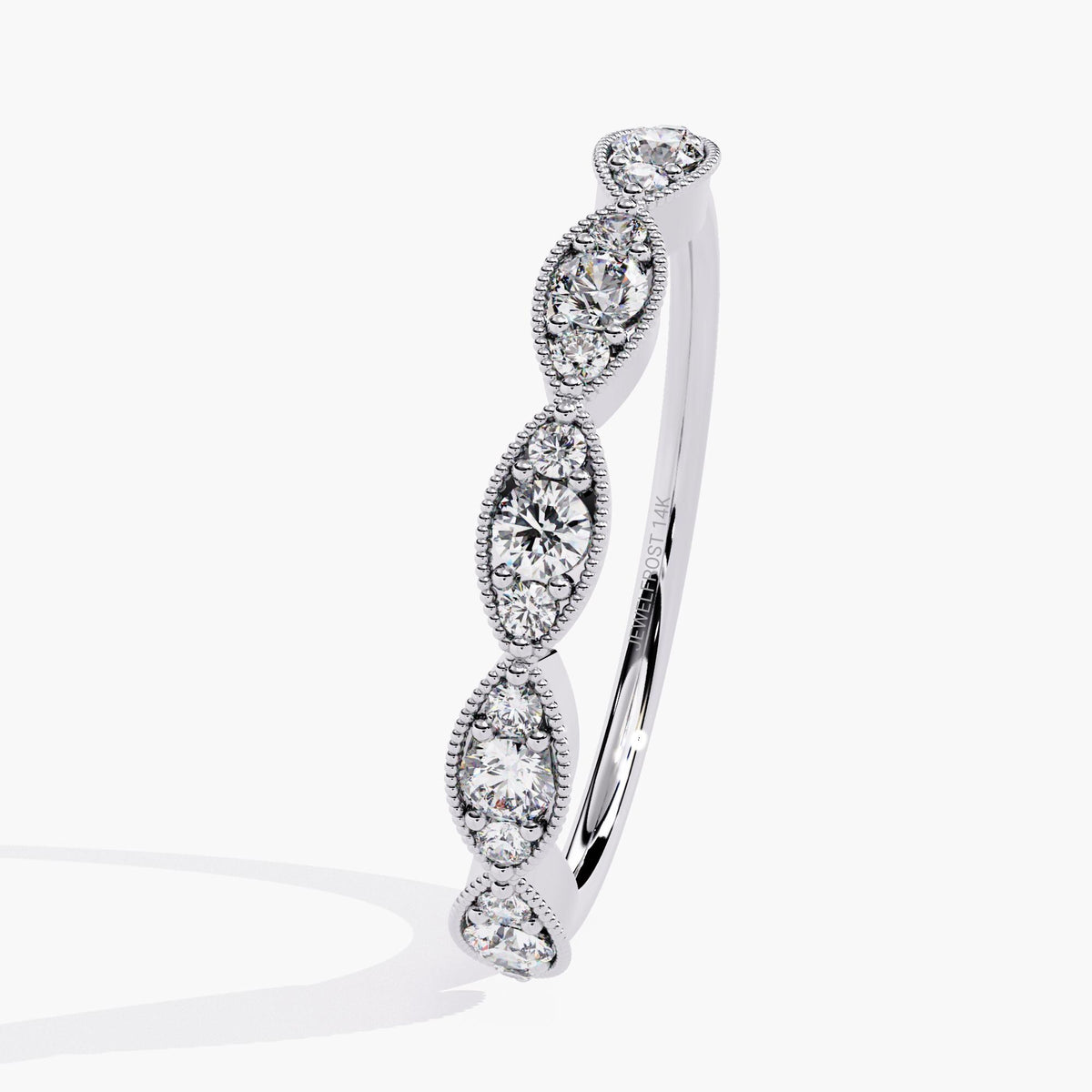 Angled view of a 14k white gold ring showing five marquise-shaped bezels, each with three round lab-grown diamonds. The polished band and detailed milgrain edging create a clean, structured look. A modern heirloom-style piece ideal for everyday fine jewelry or anniversary gifting.