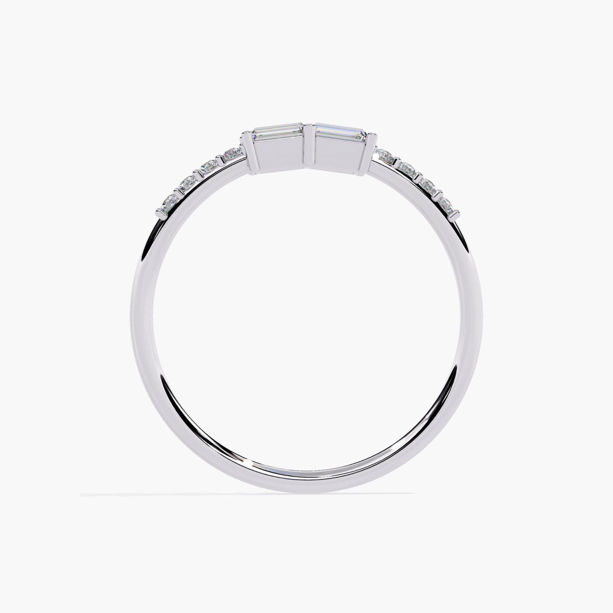 A white gold band ring with a baguette diamond and smaller round diamonds on the band.