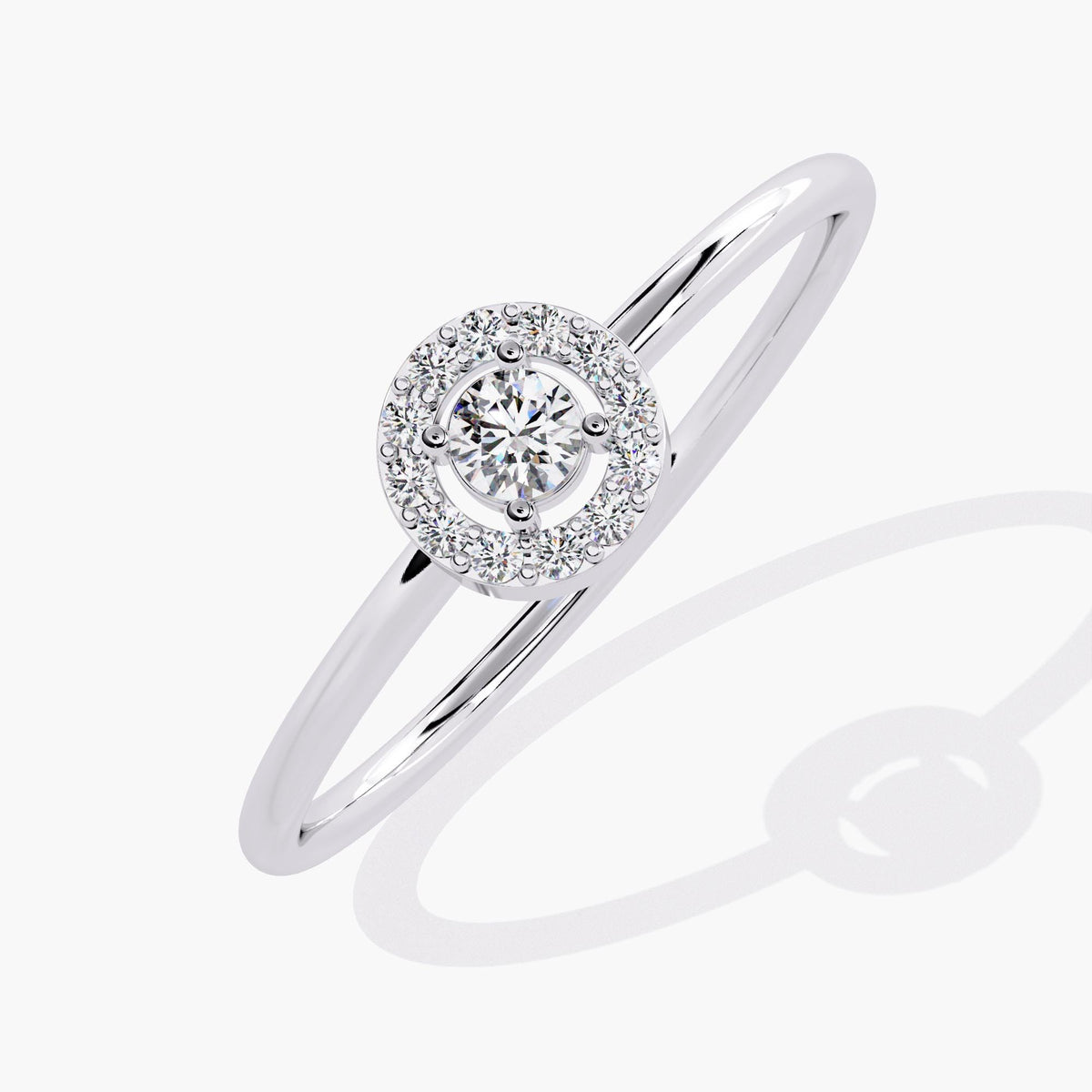 A white gold band ring with a single round diamond set in a halo of smaller diamonds.