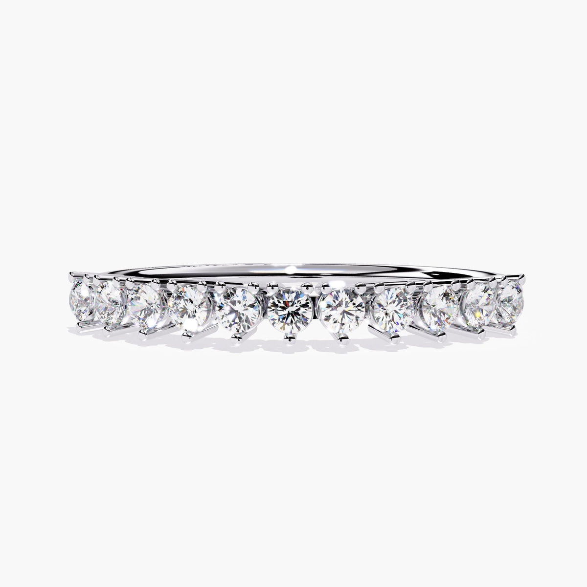 A white gold half eternity band with a row of small, round, clear diamonds.
