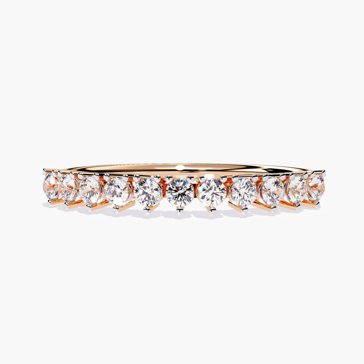 A rose gold half eternity band with a row of small, round, clear diamonds.