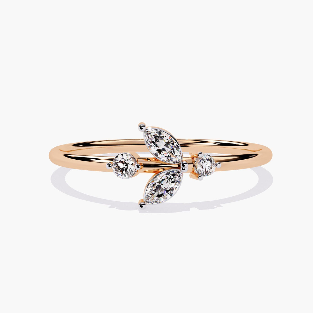 A rose gold ring with a delicate leaf design featuring marquise-shaped diamonds and two round diamonds.