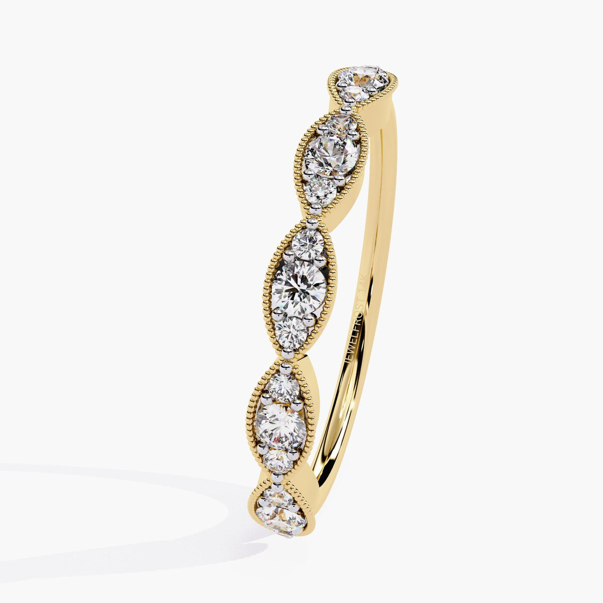 Angled view of a 14k yellow gold band featuring five marquise-shaped bezels, each set with three round lab-grown diamonds. The fine milgrain edging adds vintage character, while the gentle curve and warm gold tone give it a soft, romantic feel. A refined piece for gifting or everyday fine jewelry.